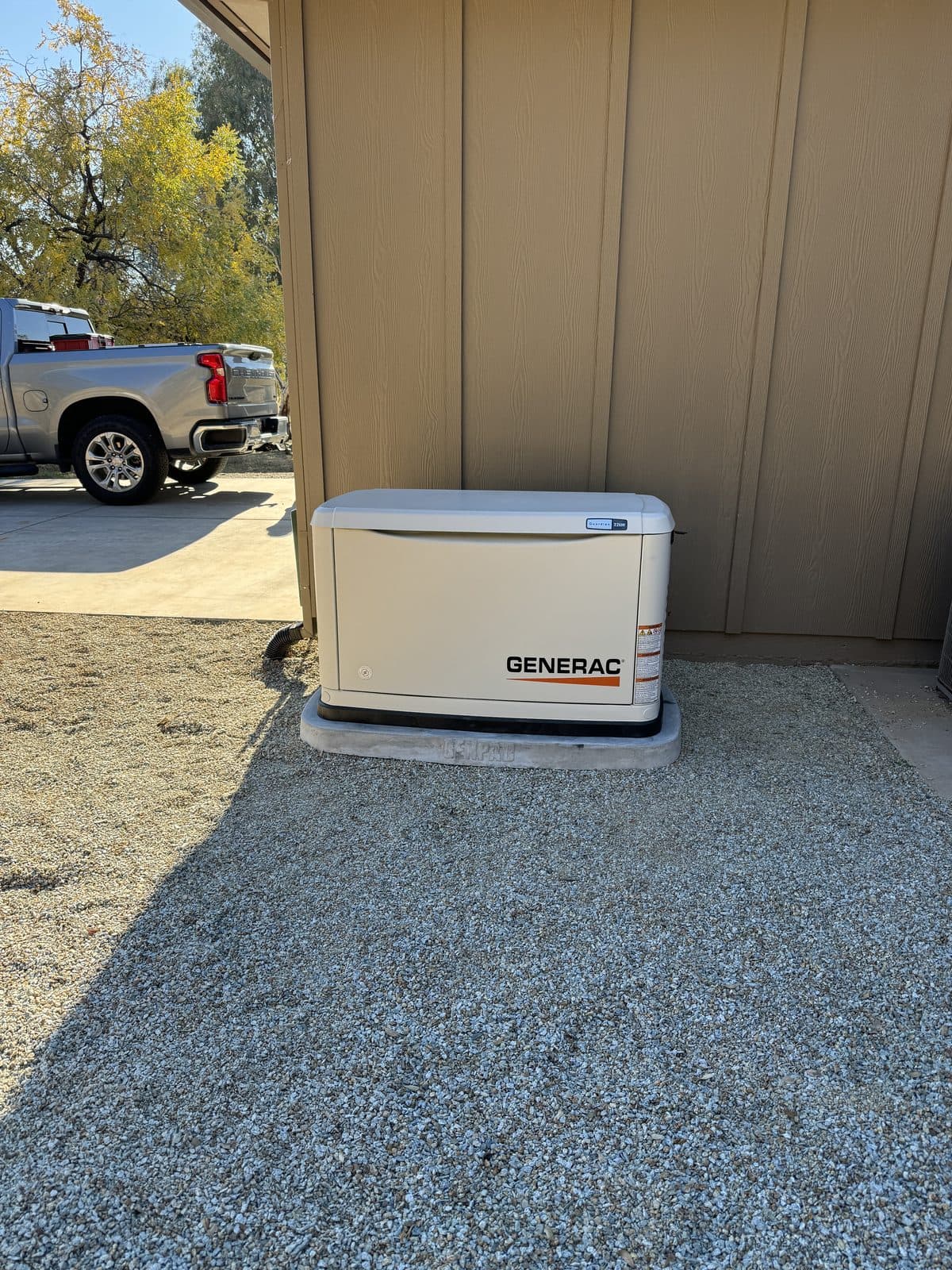 Generac standby generator installed at the side of a home